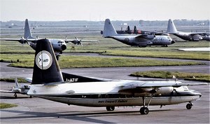 Fokker F27 Friendship 200, I-ATIF, cn 10321. First flight as PH-FKR. Here is taken at Pisa Galileo Galilei Airport with the C-130 Hercules and C-119 Flying Boxcar in the background..jpg